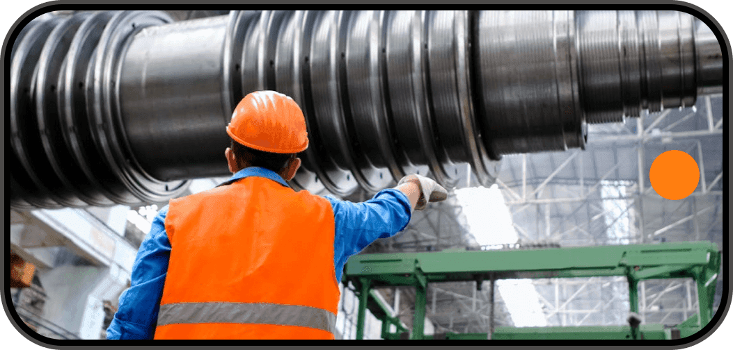 Technician inspecting an industrial roller on the shop floor